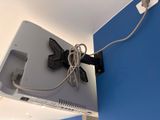 a tv that is connected to a wall with a cord