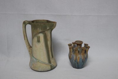 two vases sitting next to each other on a table