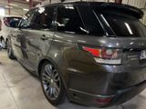 a grey car that is parked in a garage