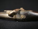 a close up of a gun on a black surface