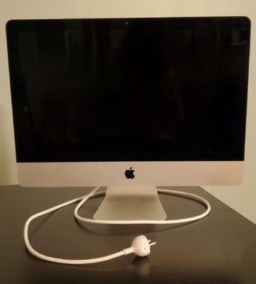 a computer on a desk with a cable plugged into it