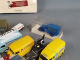 many toy cars and trucks that are sitting on a table