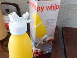 a bottle of orange juice next to a box of orange juice on a table