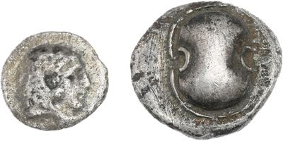 une image représentant une pièce d'argent sur laquelle figure un visage