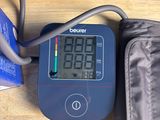 a blood pressure monitor and a bag on a table