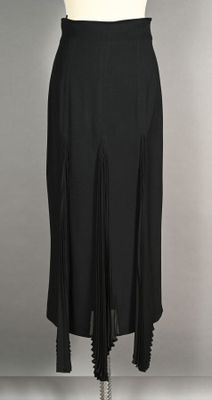 CHRISTIAN DIOR Coordonnés. Jupe midi droite en crepe noir à …