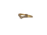 a close up of a gold and diamond ring on a white background