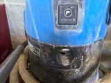 a blue machine that is sitting on top of a table