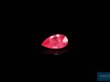 a pink diamond on a black background
