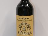 an image of a bottle of red wine sitting on top of a table