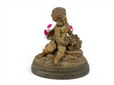 bronze figurine of a boy with a basket of flowers on a pedestal