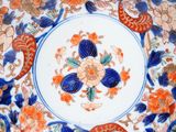 an image of a decorative plate with flowers on it