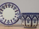 a blue and white bowl and a plate on a table