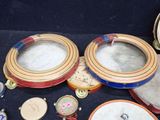 many different types of clocks on the table together