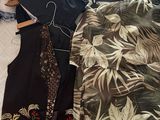 a lot of clothes that are on a bed