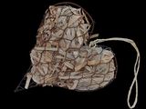 a picture of a bag of wood chips on a black background