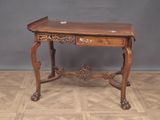 a small wooden table with a drawer on top of it