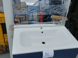 a sink with a mirror on top of it in a store