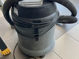 a vacuum that is sitting on the floor next to a ladder