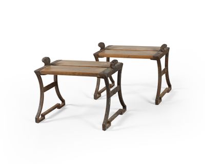 a pair of wooden benches sitting next to each other on a white surface