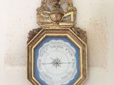 a clock hanging on the wall with a clock on it