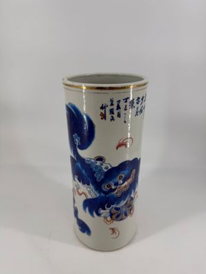 a blue and white vase with a dragon on it