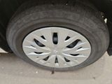 a close up of a car ' s tire on the street
