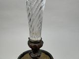 a glass vase that is sitting on a table