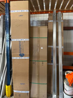 a large stack of boxes on a pallet in a warehouse