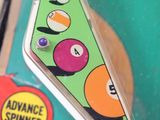 a pinball game with a triangle shaped pinball on it
