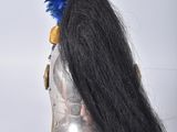 a black wig with a red, white, and blue hat on top of it