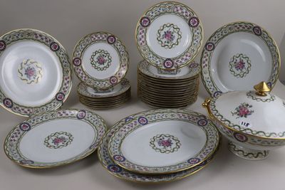 a lot of plates and bowls that are sitting on a table