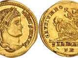 a gold coin with an image of a woman on it