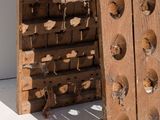 a wooden structure with holes on the side of it