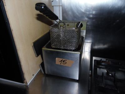 an image of a fryer with a knife in it