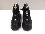 the black boots are lined up and ready to be worn