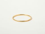 a gold ring on a white background