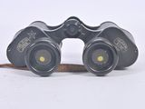 a pair of binoculars that are sitting on the ground