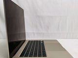 an open laptop computer sitting on top of a white table