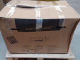 a cardboard box sitting on a pallet in a warehouse