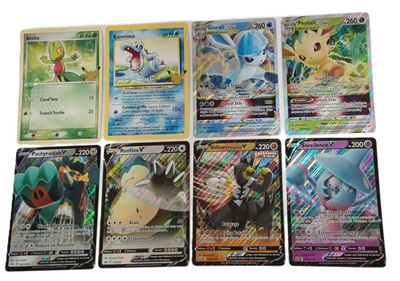 Plusieurs cartes Pokémon sont alignées les unes à côté des autres sur une surface blanche