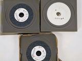 three cds in a box on top of each other