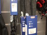 many umbrellas hanging on the wall in a store