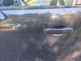 a close up of a door handle on a car