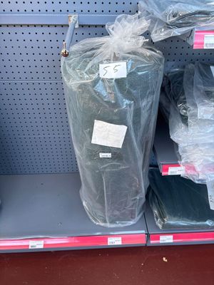 many bags of clothing on the shelf in the store