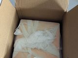 a cardboard box that has a bunch of items inside of it