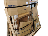 a large stack of boxes on a pallet on a white background
