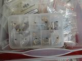 a plastic container filled with many different types of sewing supplies