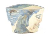 a blue and white bowl with a painting on it