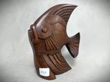 an image of a wooden fish figurine sitting on a table